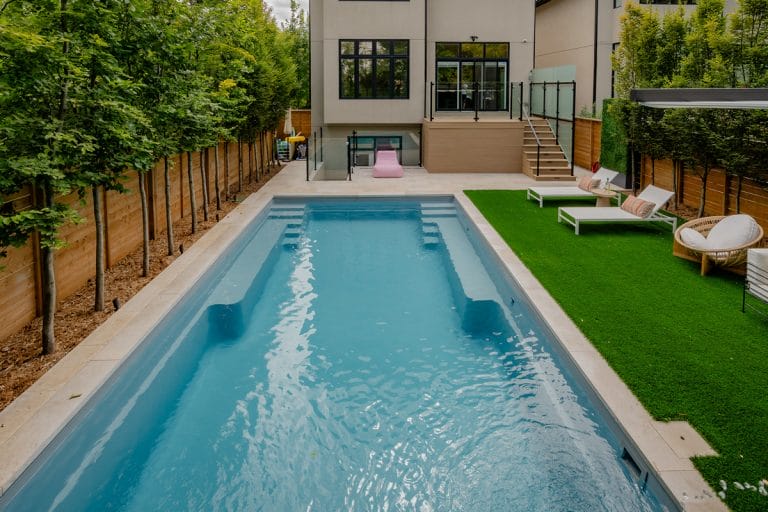 landscaping project in Toronto featuring a new built deck and inground swimming pool