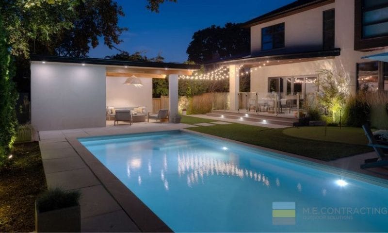 Landscaping project featuring pool construction and deck building in Toronto