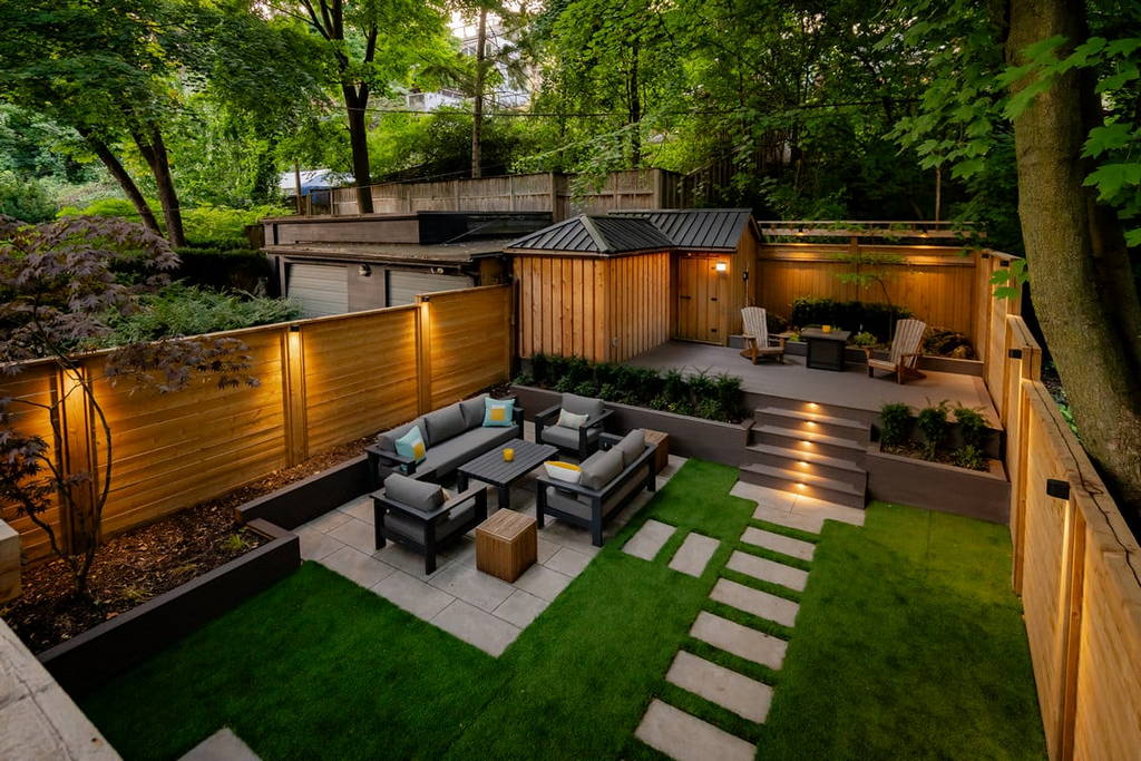 Landscaping project with composite deck and fence installation in Toronto backyard