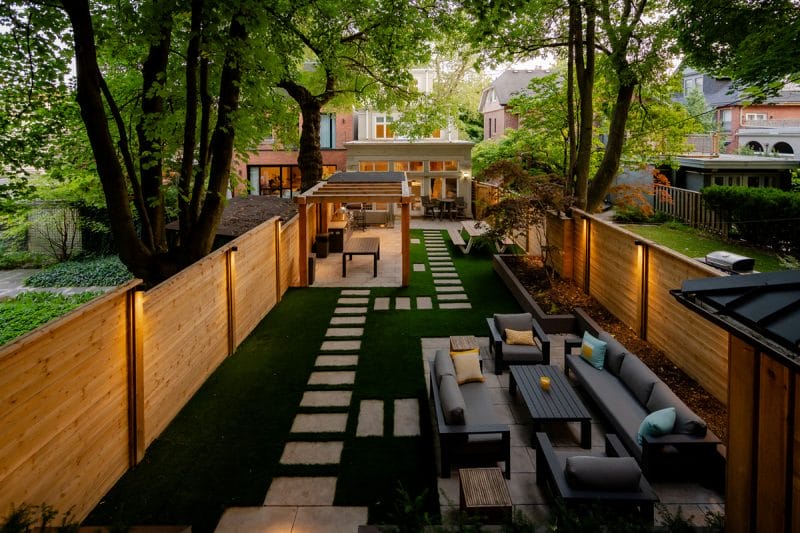 landscaping project with gazebo, fence, sandstone patio and paths