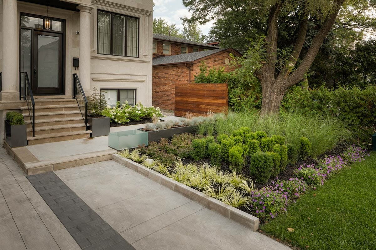 front porch landscaping, interlocking and fencing build by M.E. contracting