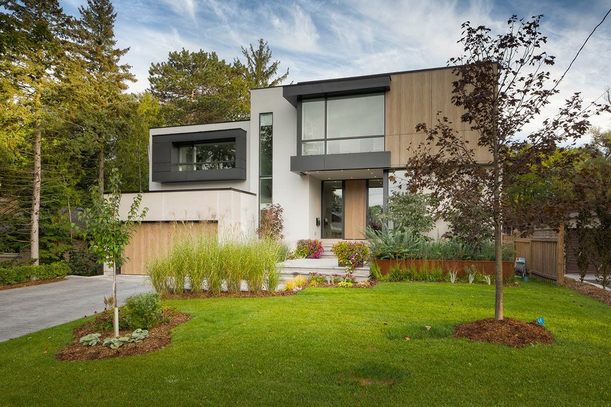 Modern Toronto Front Yard Landscape Design & Interlocking Project; Featuring Driveway Paving & Retaining Wall