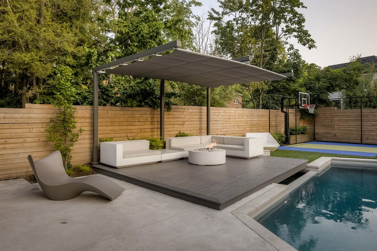 Landscaping construction with Metal Pergola, Outdoor Fireplace, Pool Installation, and Sports Court.