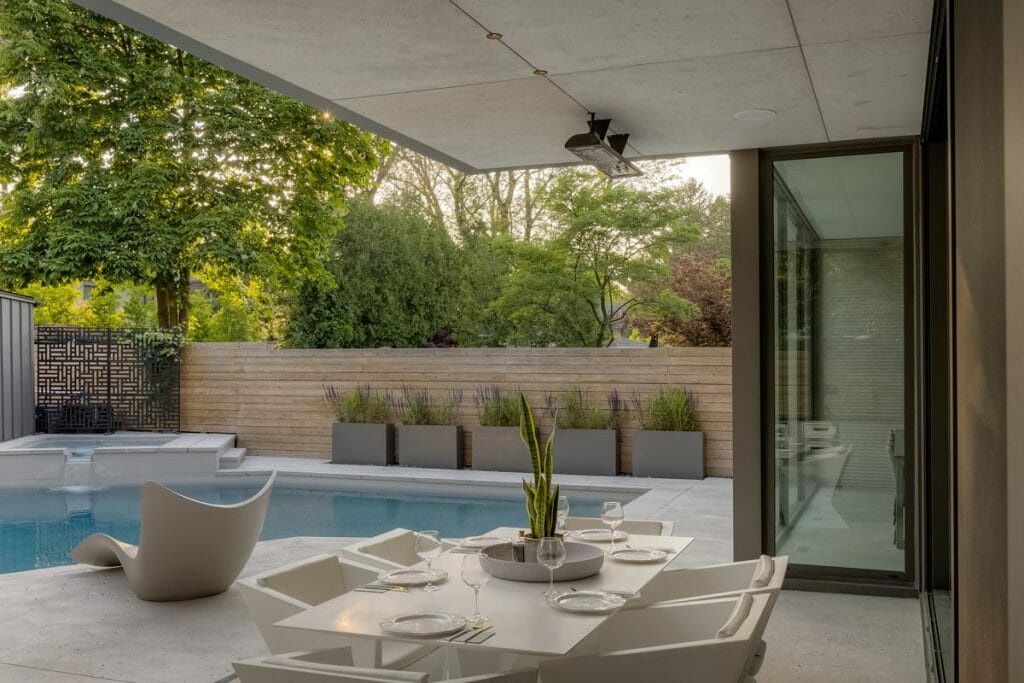 Backyard Landscaping by M.E. Contracting: Planters, Privacy Fence, Stone Interlocking, and Water Feature Pool