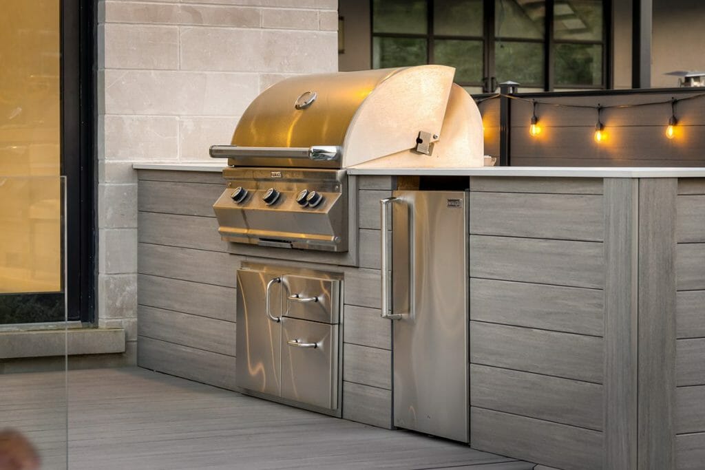 Landscaping Project Featuring Outdoor Kitchen over PVC Deck installed