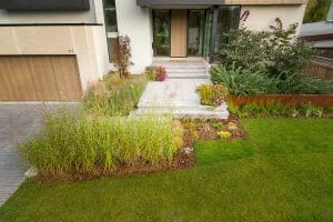 Modern Landscape Design Project; Featuring Front Entrance Interlocking Steps, Soft Scaping & Retaining Wall by Toronto Landscaping Company.