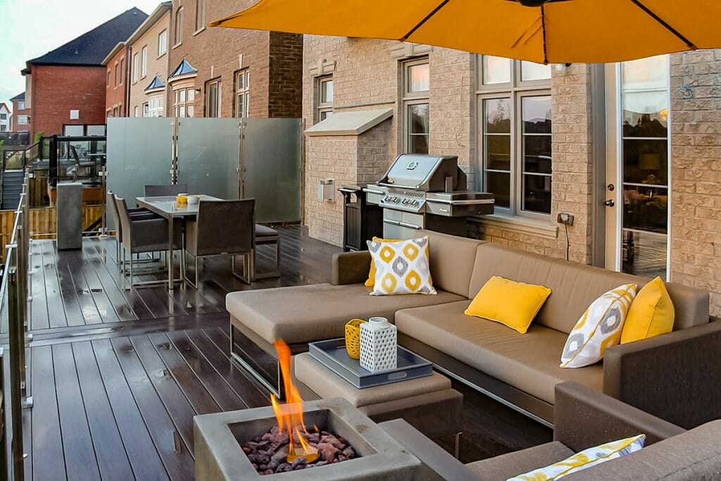 Toronto Landscaping Project; Featuring PVC Decking, Outdoor Fireplace, Stainless Steel & Glass Railings.