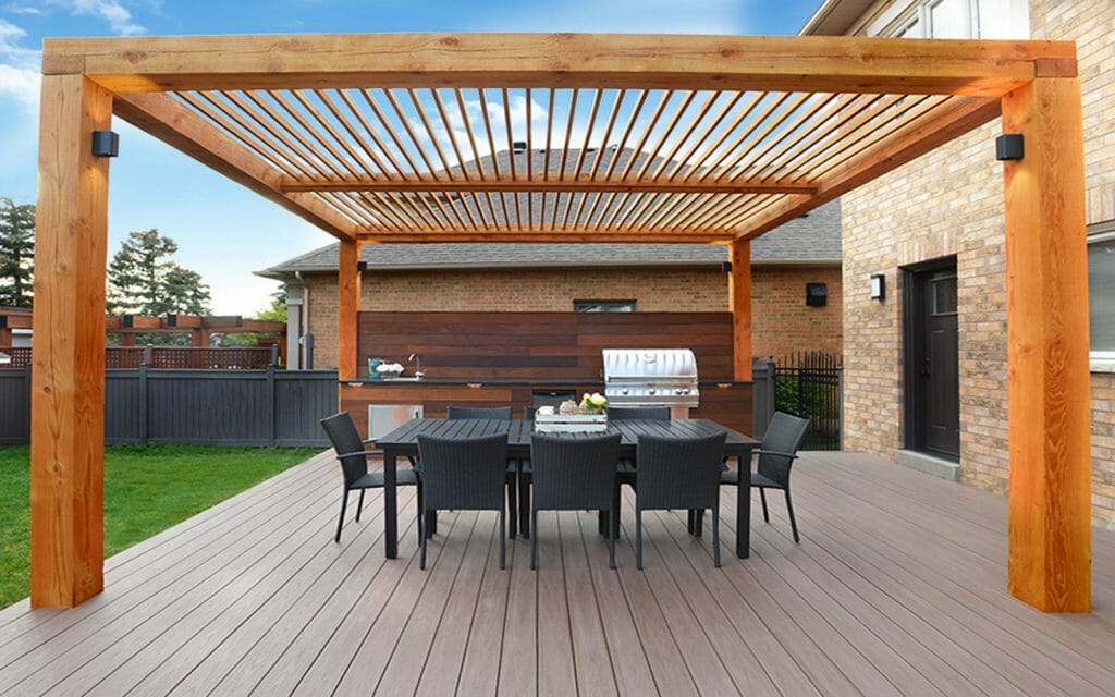 TimberTech deck project by The Deck Builders Toronto featuring outdoor kitchen, irrigation sprinkler system, and custom woodworking