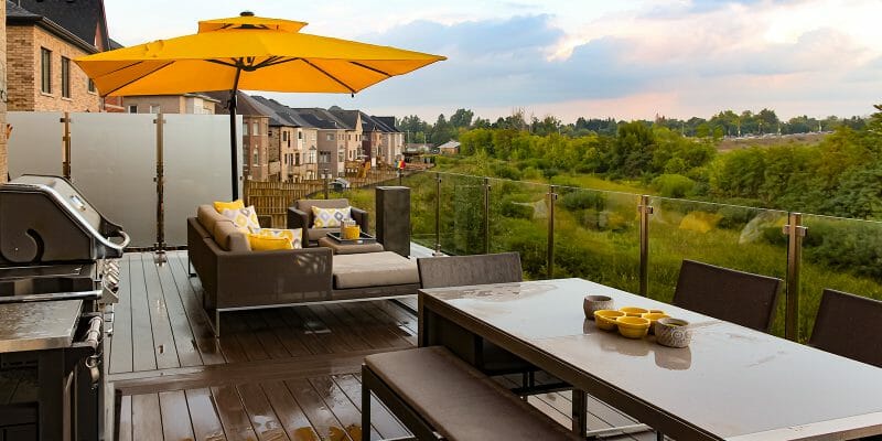 Toronto backyard Deck construction Project; Featuring PVC Decking, Outdoor Fireplace Stainless Steel & Glass Railings