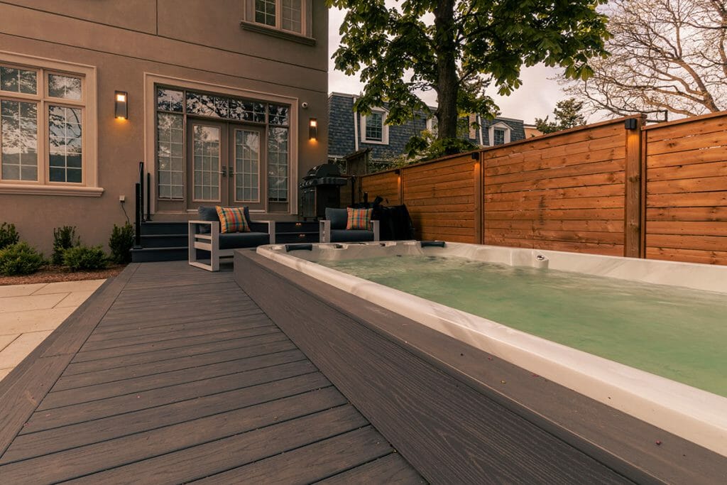 Premium backyard Landscaping design and build Project; Featuring Interlocking, PVC Decking, Patio Design, & Swim Spa Installation