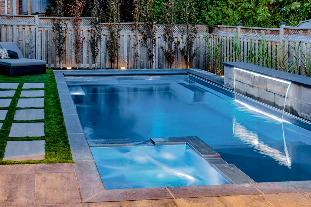 Toronto Pool installation project features pool side interlocking and installed water feature
