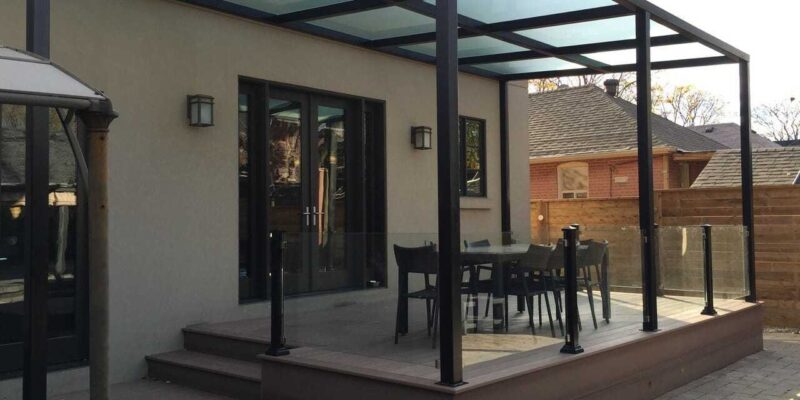 Toronto deck building project featuring deck and pergolas with tempered glass railing by M.E contracting