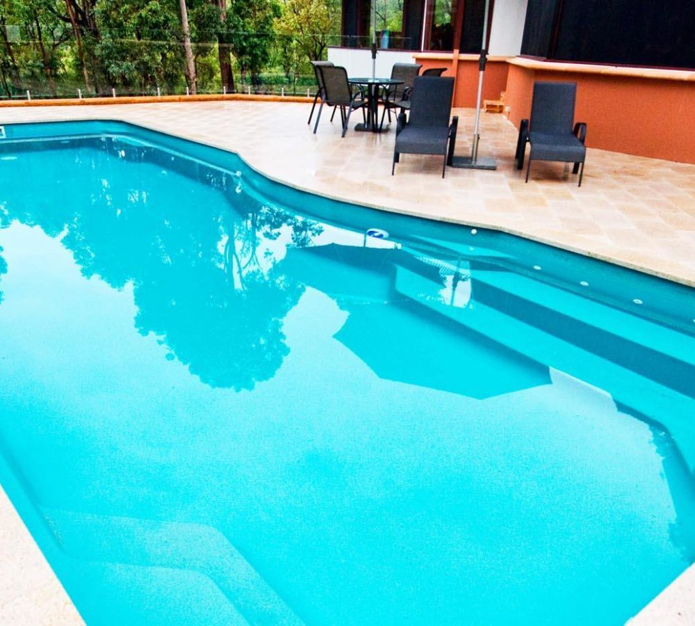 Moroccan Fiberglass pool installation with coping by M.E. contracting pool construction