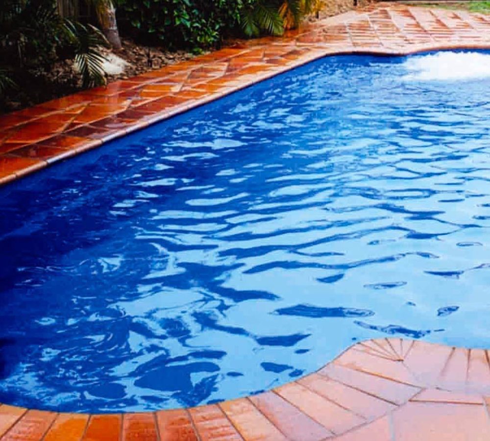 Roman Fiberglass pool with water feature