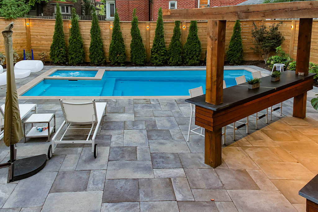 Toronto Pool construction, patio build with Privacy Fence