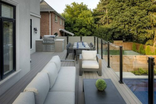 Toronto Backyard deck building featuring Two-Story PVC Deck and landscaping