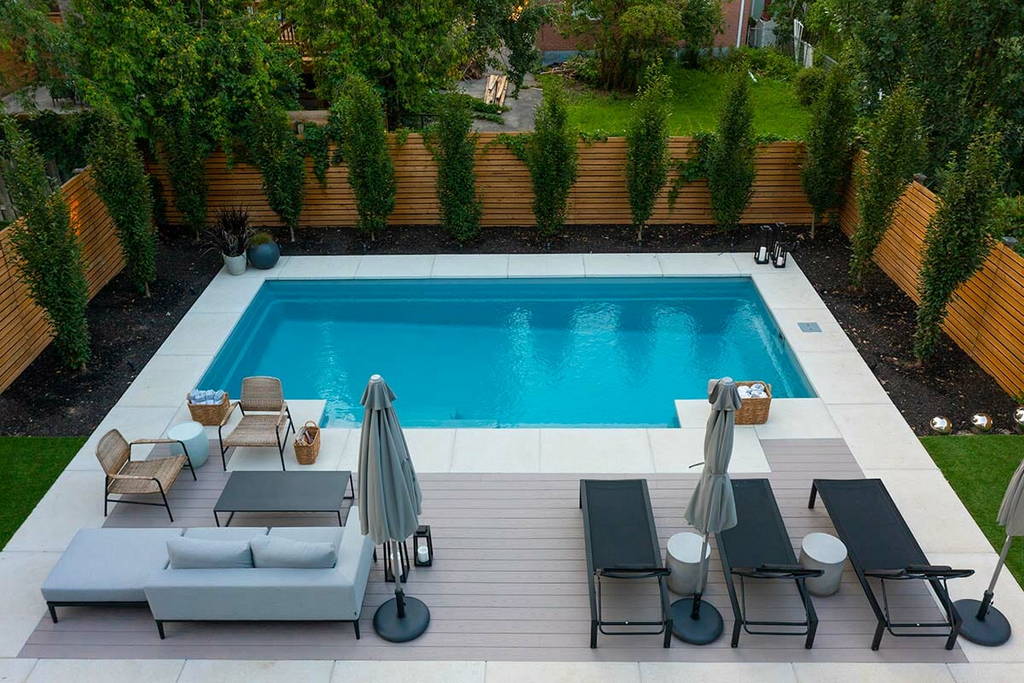 Toronto Backyard Fiberglass Pool construction, Patio Design with PVC Decking, & landscaping.