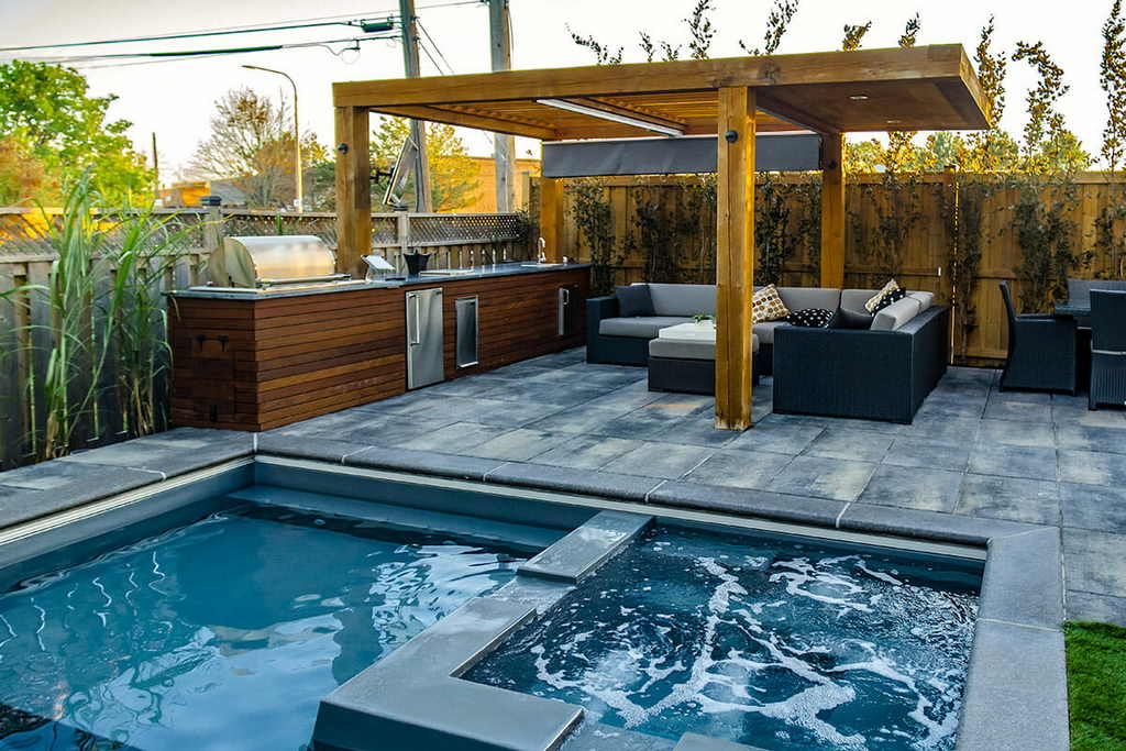 Backyard Landscaping Design and build Project Featuring Woodworking Pergola, Interlocking, Outdoor Kitchen & Fiberglass Pool construction