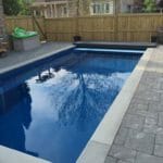 Toronto Pool construction with stone edging and interlocking patio