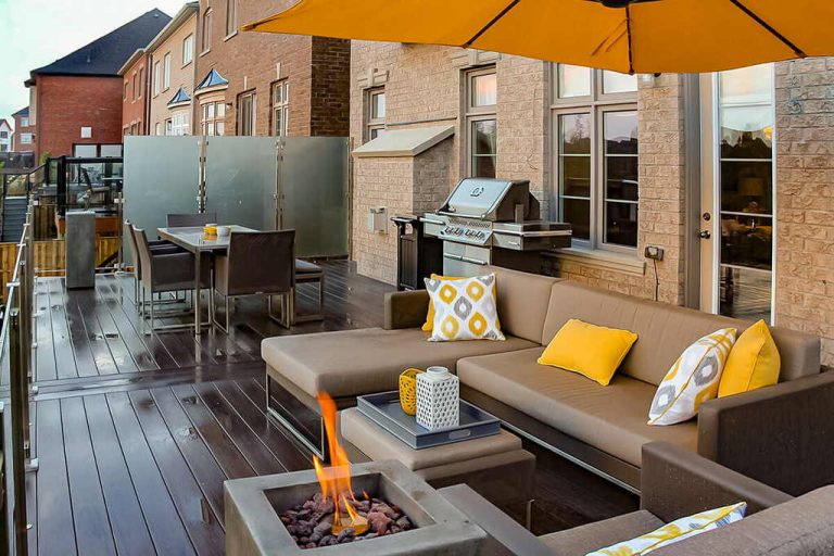 Toronto Landscaping Project; Featuring PVC Decking, Outdoor Fireplace, Stainless Steel & Glass Railings.