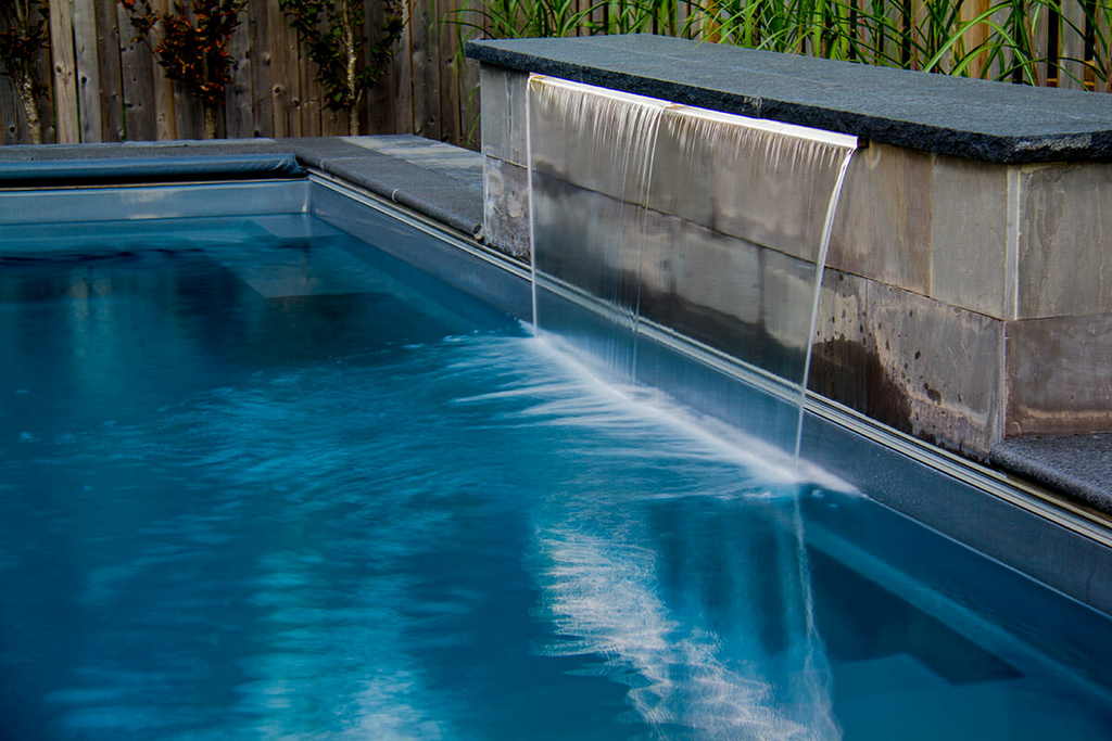 Fiberglass inground Pool with Water Feature construction Project, by The Toronto pool builders