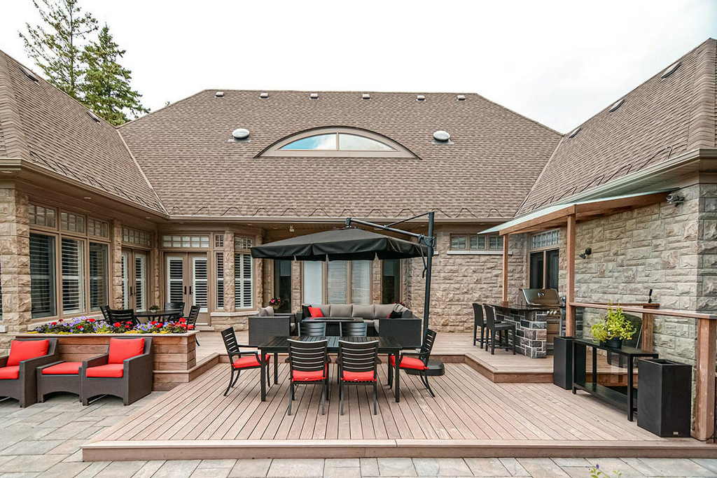 Toronto backyard deck construction & Interlocking Project; Featuring IPE Decking, IPE Privacy Fence, Woodworking Pergola.