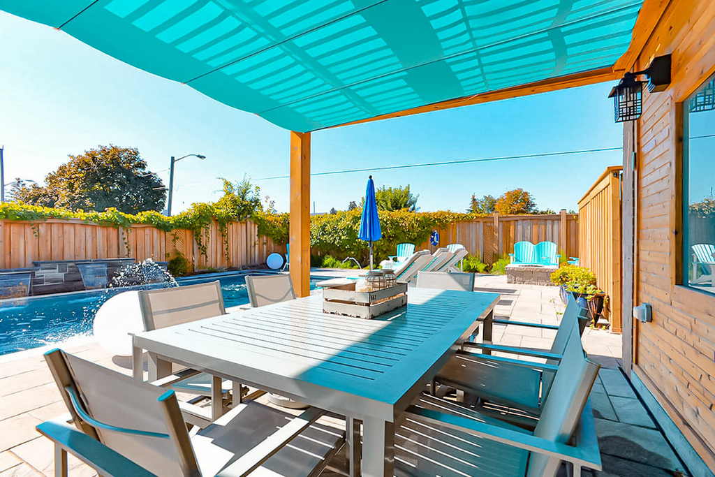 Toronto Backyard Landscape design with fiberglass pool, patio and cedar pergola