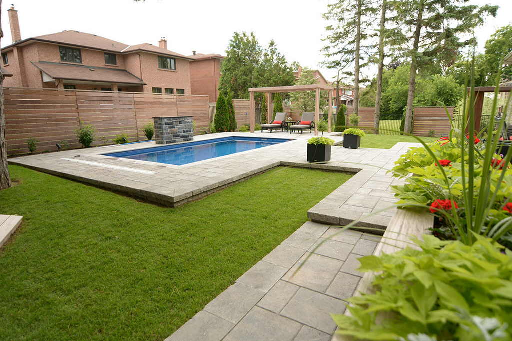 Toronto deck building Company Featuring Interlocking, Landscape Design, Fiberglass Pool installation, IPE Privacy Fence & Woodworking Pergola.