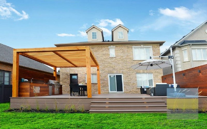 composite deck with wooden pergola build by M.E. contracting