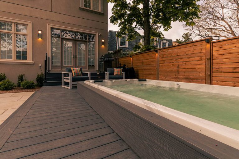 Premium backyard Landscaping design and build Project; Featuring Interlocking, PVC Decking, Patio Design, & Swim Spa Installation