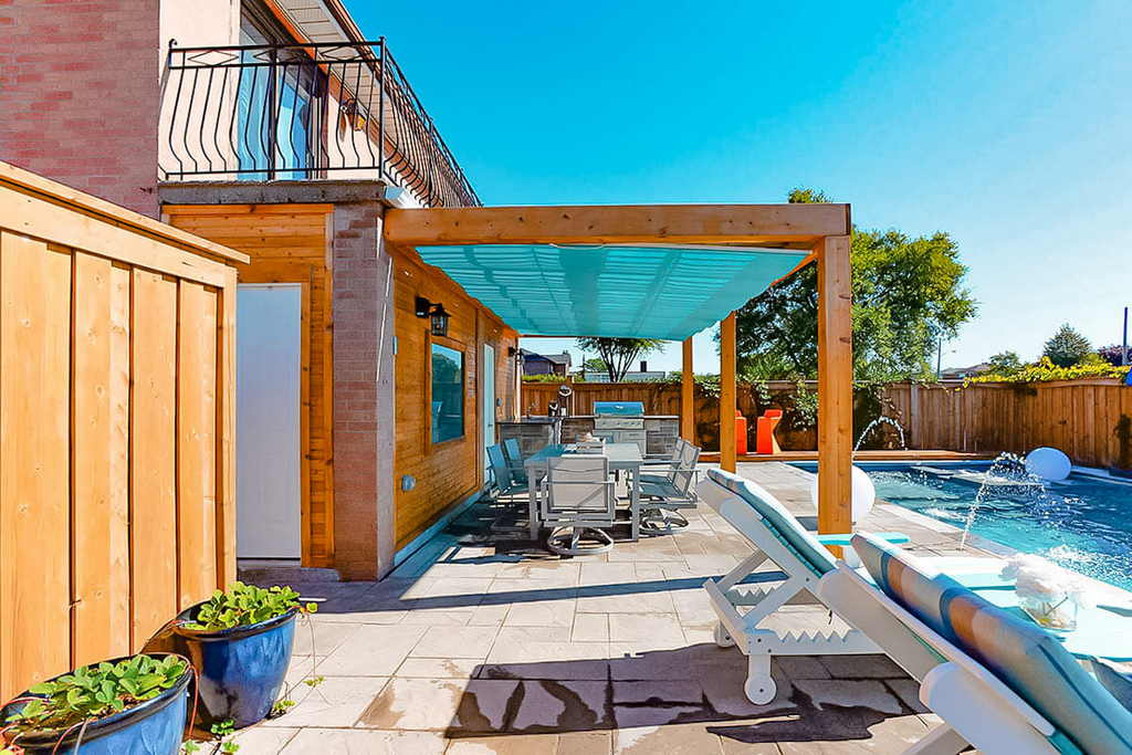 Landscape and Woodwork Project Including Pergola, Patio, and Pool Installation